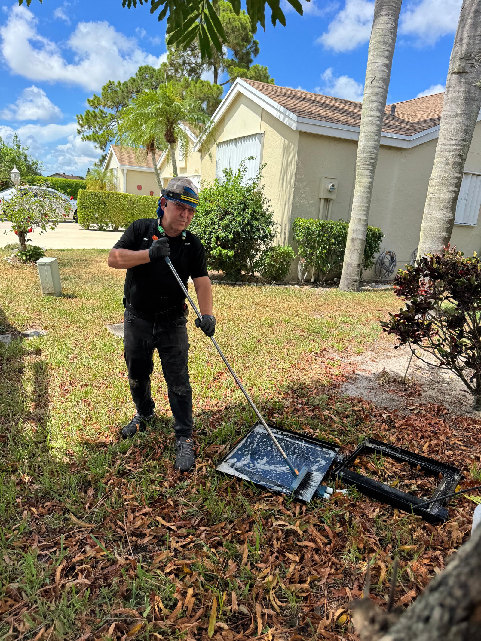 Technician cleaning HVAC components